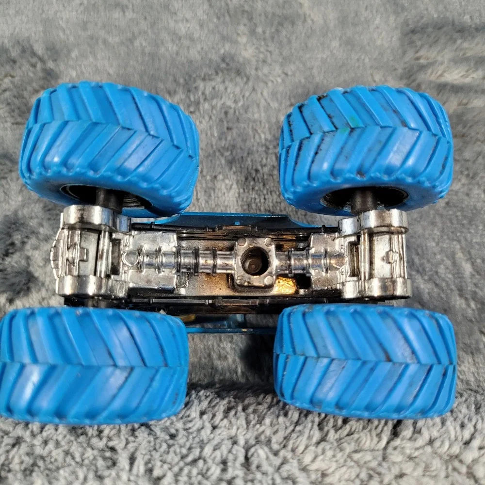 Hot Wheels Monster Jam Blue Thunder and NEA Police 1:64 Diecast Truck Lot of 2